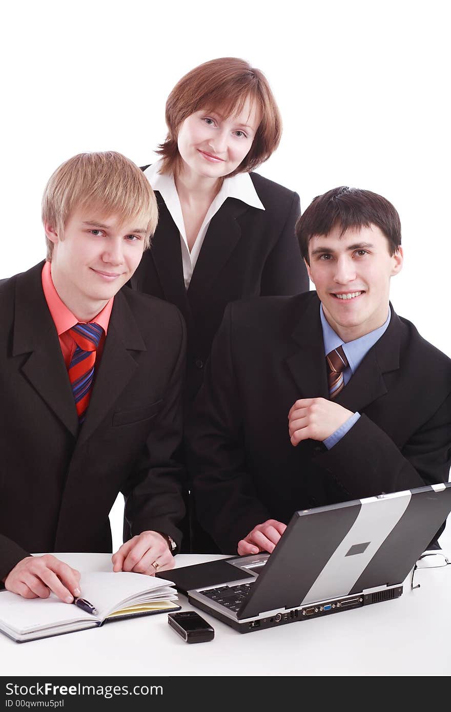 Group of business people working together. Shot in studio. Group of business people working together. Shot in studio.