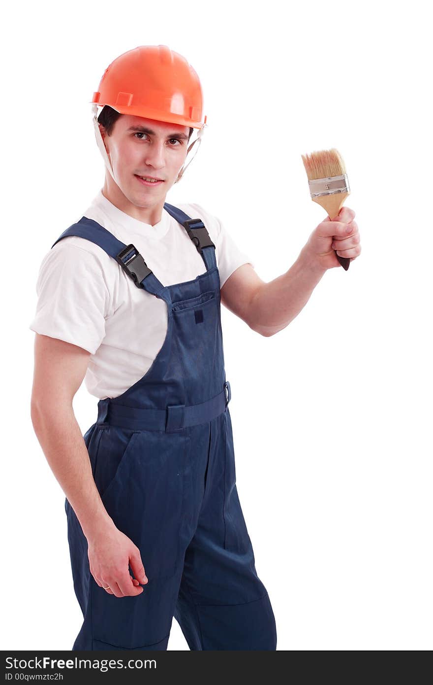 Muscular young man in a builder uniform with tools. Muscular young man in a builder uniform with tools.