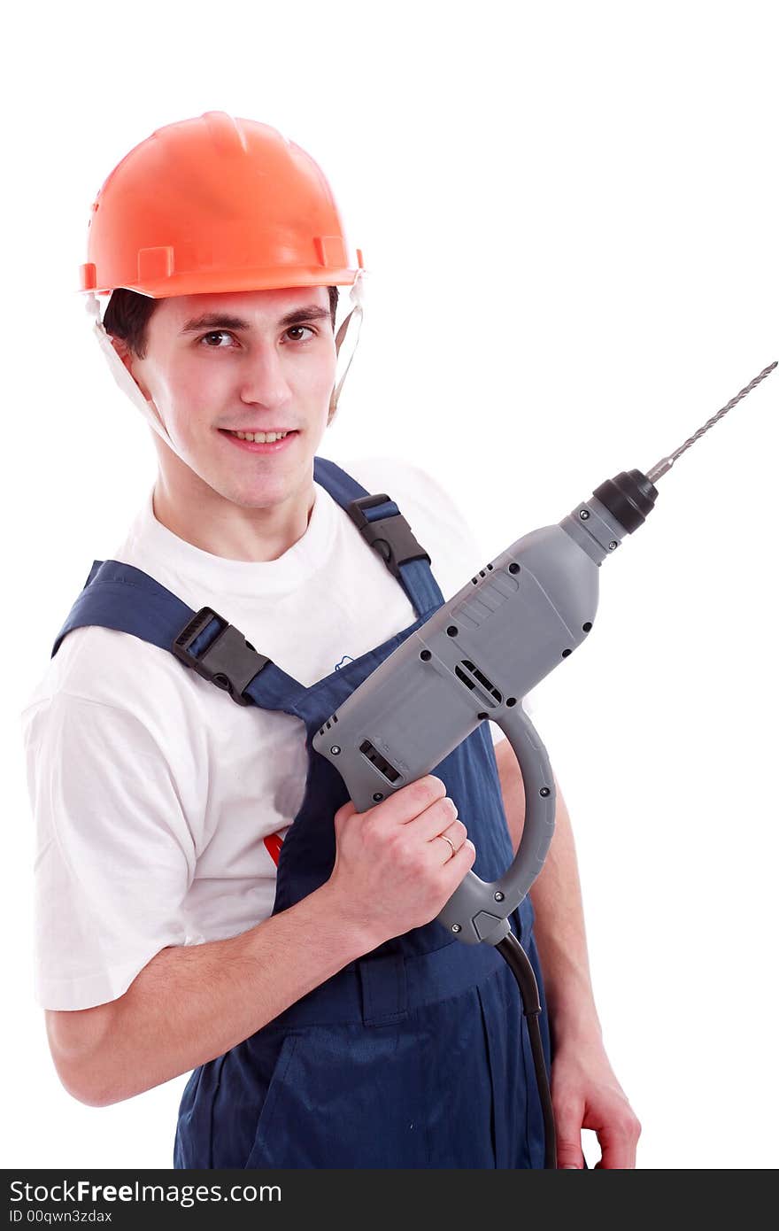 Muscular young man in a builder uniform with tools. Muscular young man in a builder uniform with tools.