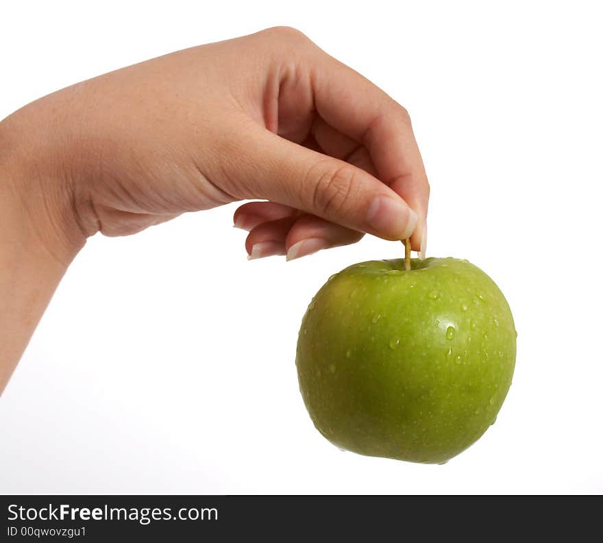 Holding a fresh and tasty green apple