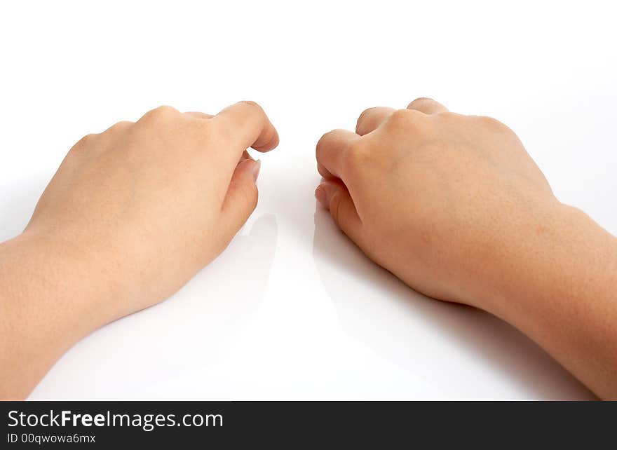 Hands on top of a white surface