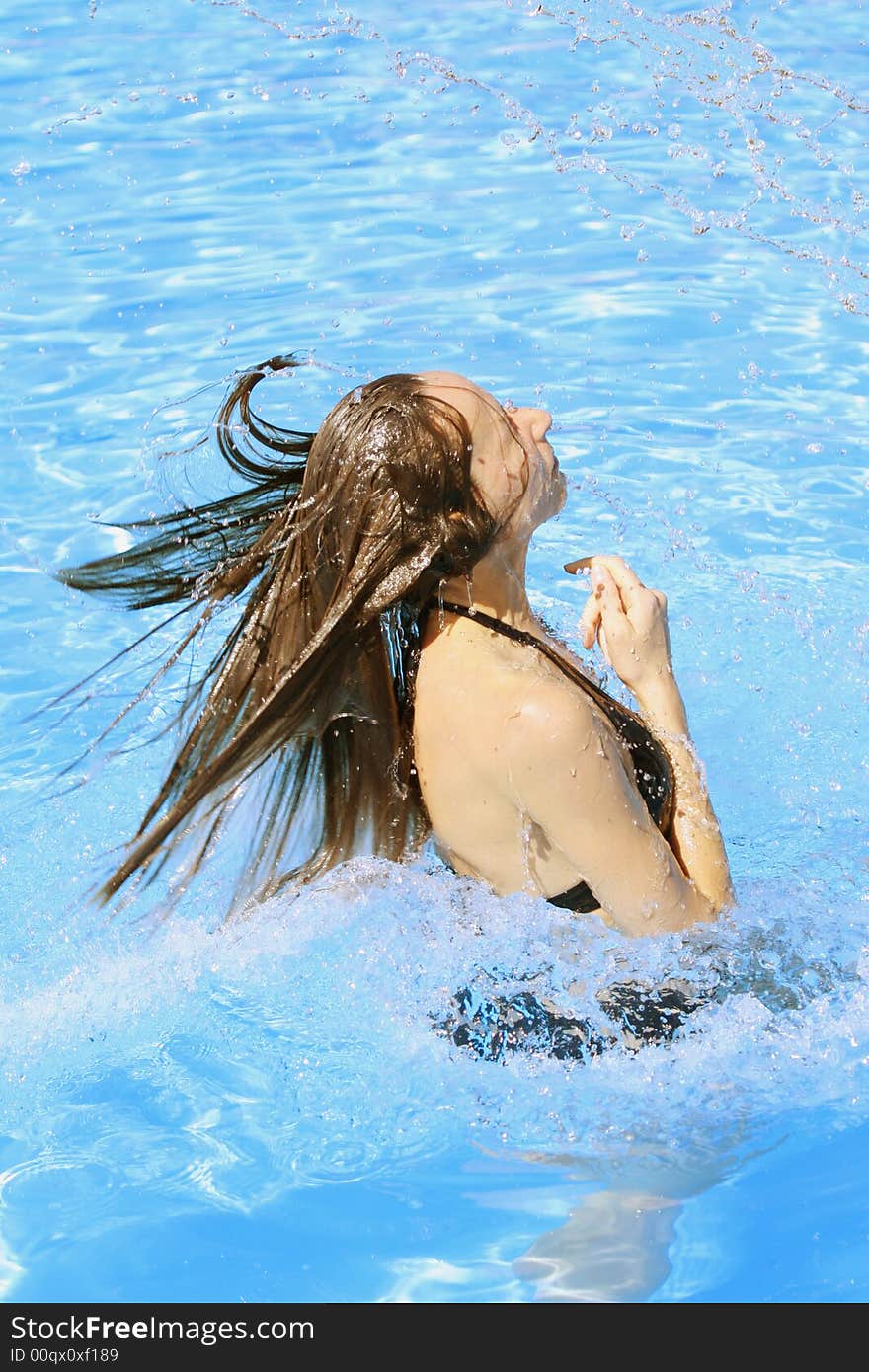 Woman takes a bath in the swimming pool. Woman takes a bath in the swimming pool