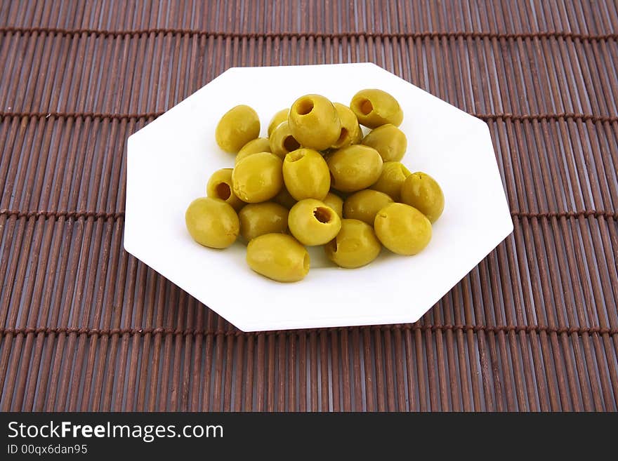 A small bowl of olives on a table