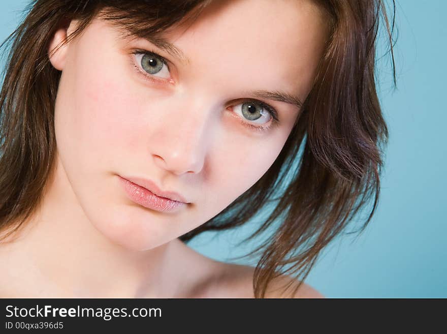 Girl with short hair on a blue background