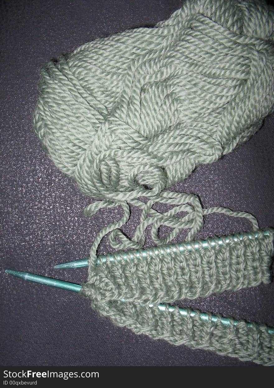 Work in progress with green wool. Work in progress with green wool