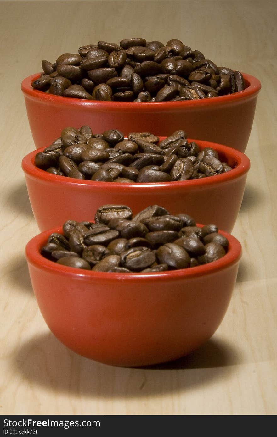 Coffee beans in red bowls