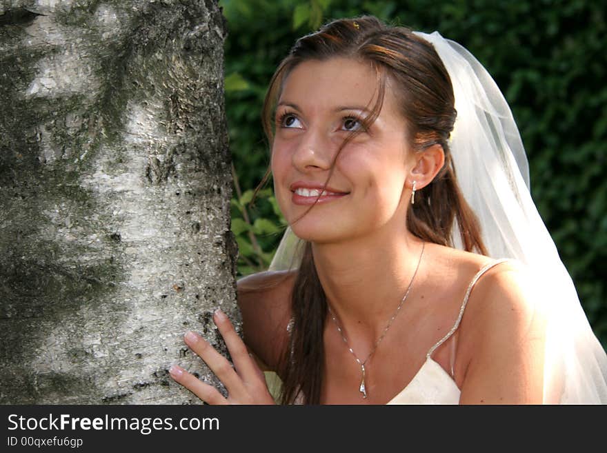 Young bride posing in the wedding day. Young bride posing in the wedding day