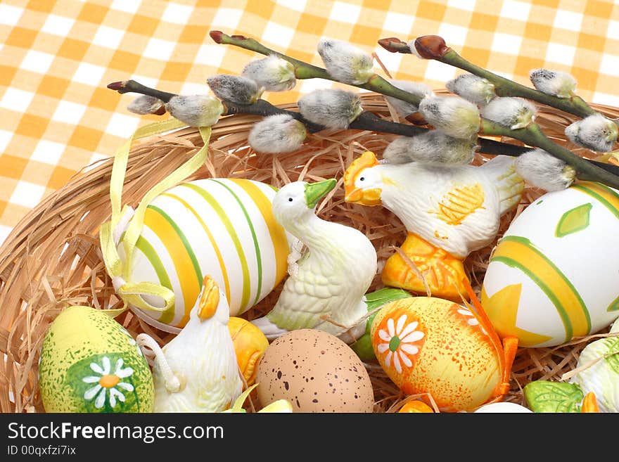 Easter decoration - goose, chick and eggs in a basket