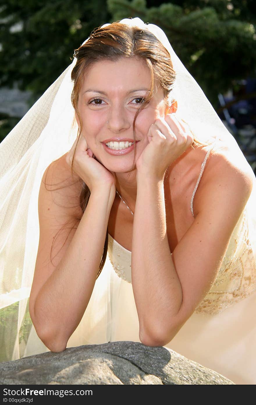 Young bride posing in the wedding day. Young bride posing in the wedding day