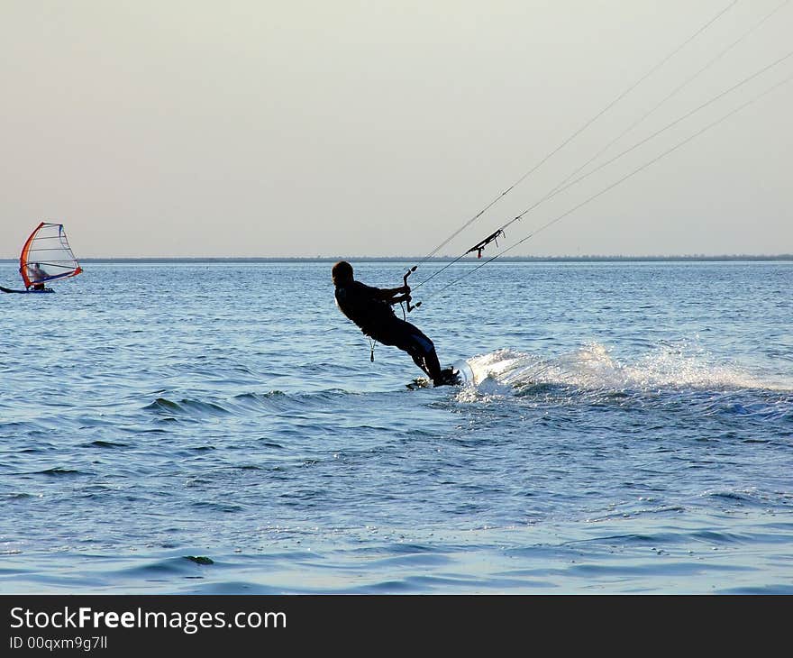 Silhouette of a kite-surf on waves of a gulf 1. Silhouette of a kite-surf on waves of a gulf 1