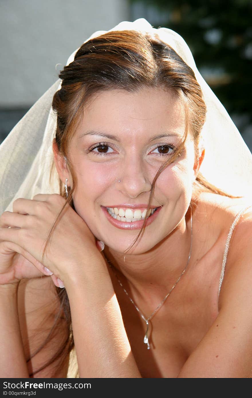 Young bride posing in the wedding day. Young bride posing in the wedding day