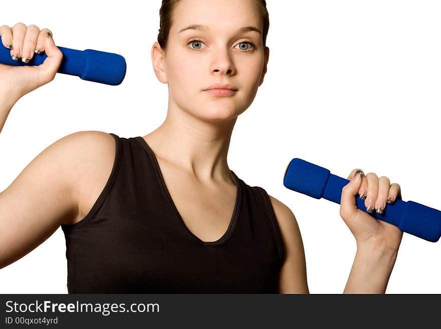 Young girl is holding the weights