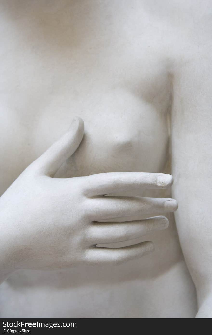 Antique sculpture with breast