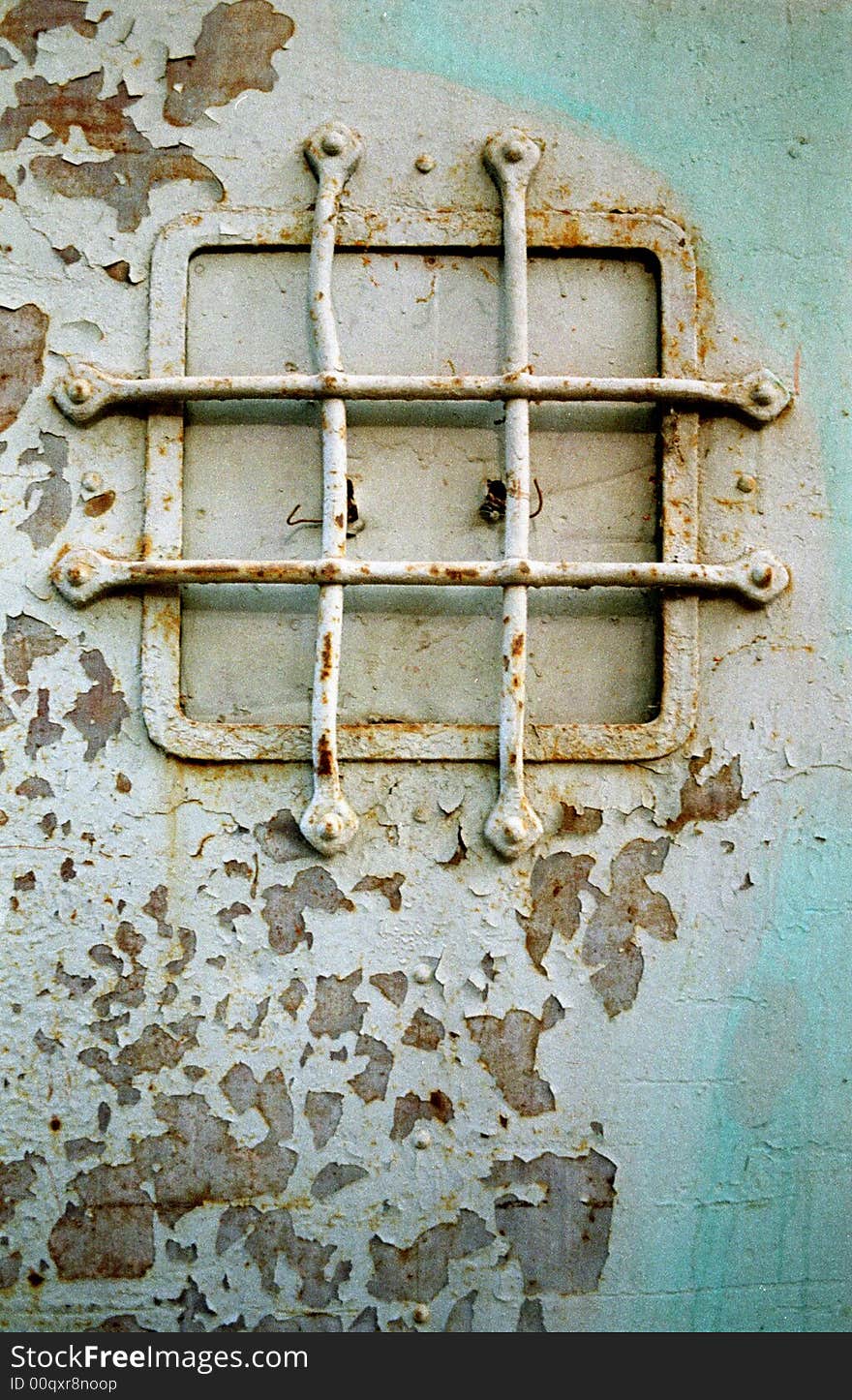 The image of a protective lattice at a window of the old reserved door. The image of a protective lattice at a window of the old reserved door