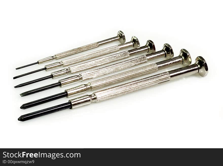 Metal Screw Driver in a row on bright Background