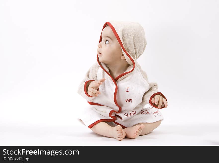 Happy baby in bathrobe