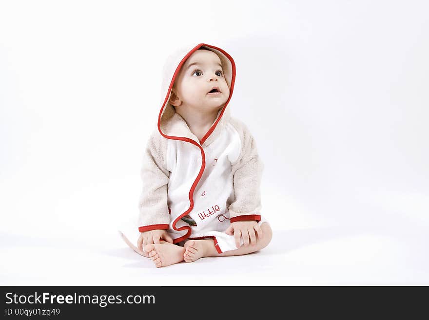 Happy baby in bathrobe