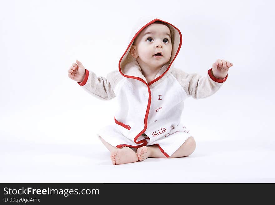 Happy baby in bathrobe