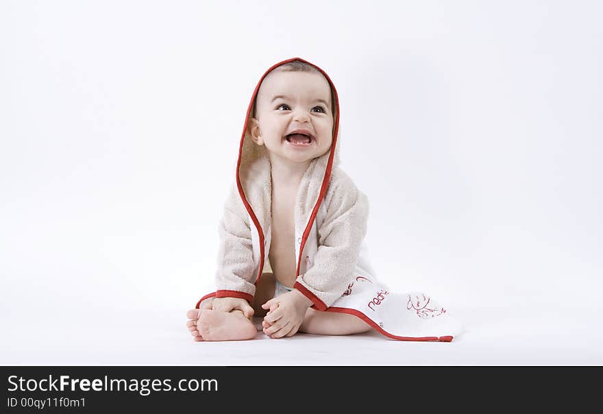 Happy baby in bathrobe