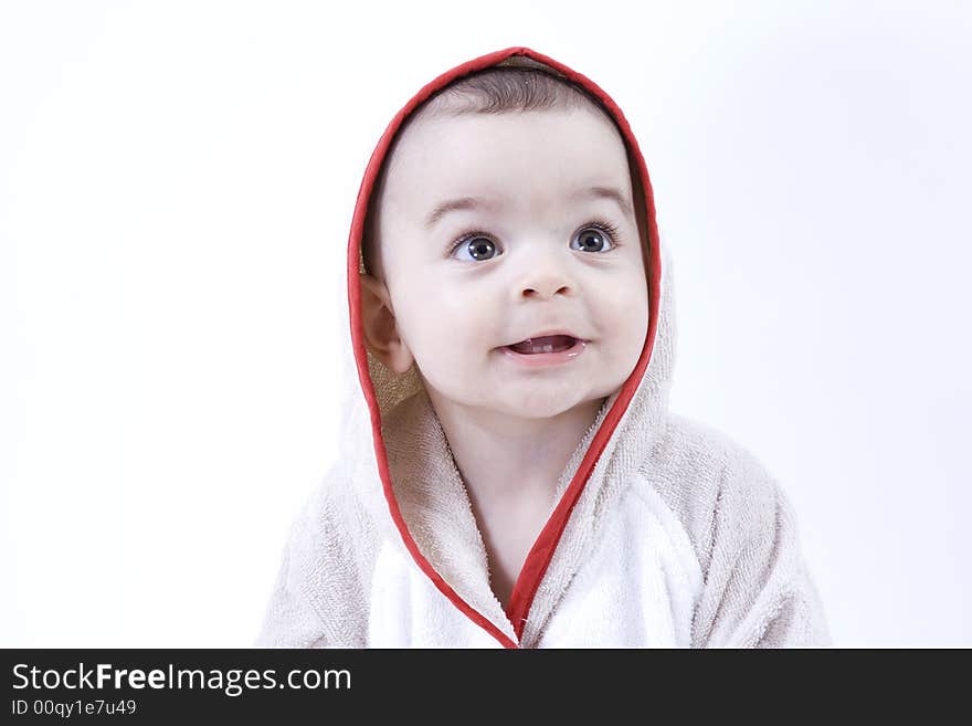 Happy baby in bathrobe