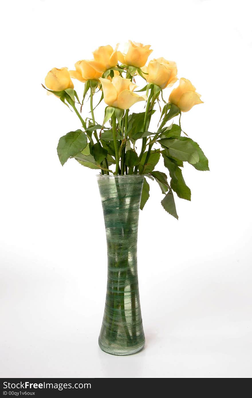 Bunch of cream roses in green vase