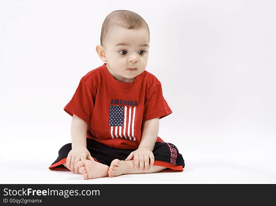Curious baby in red t shirt