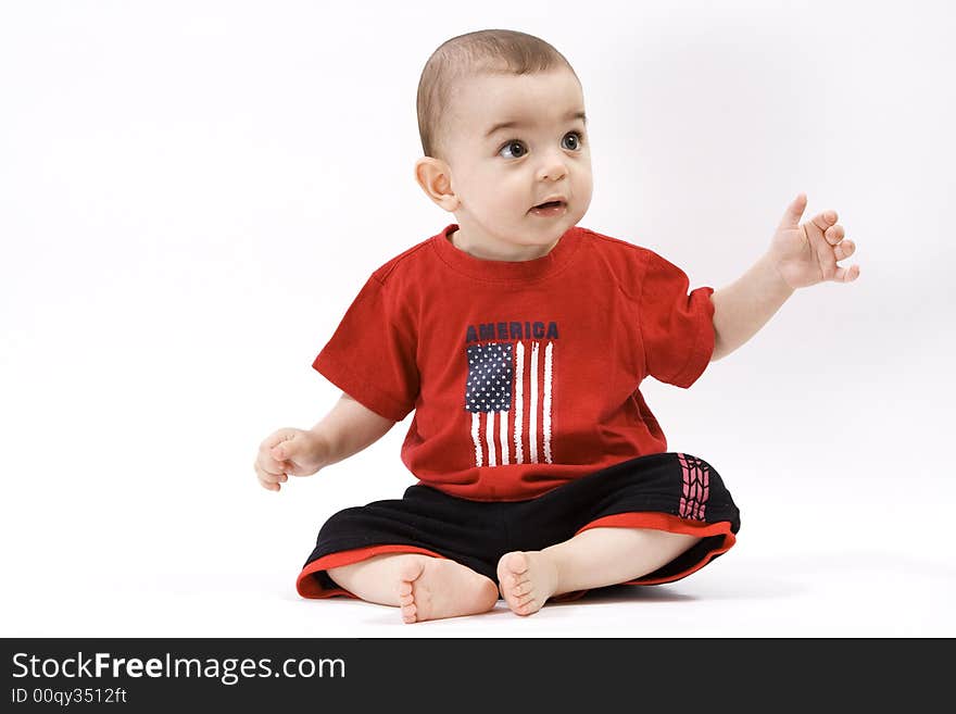 Curious baby in red t shirt