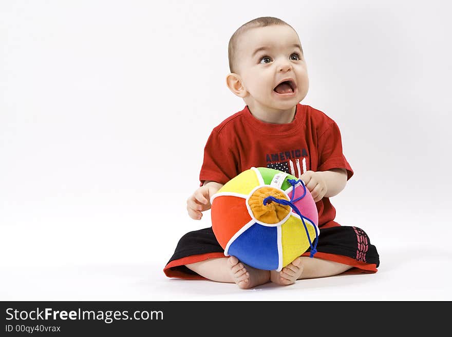 Curious baby in red t shirt. Curious baby in red t shirt