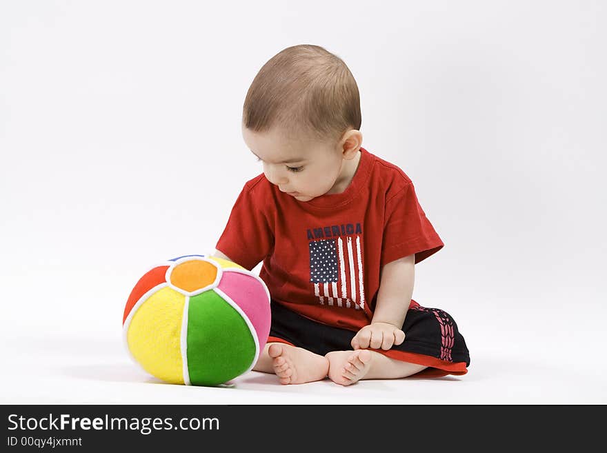 Curious baby in red t shirt. Curious baby in red t shirt