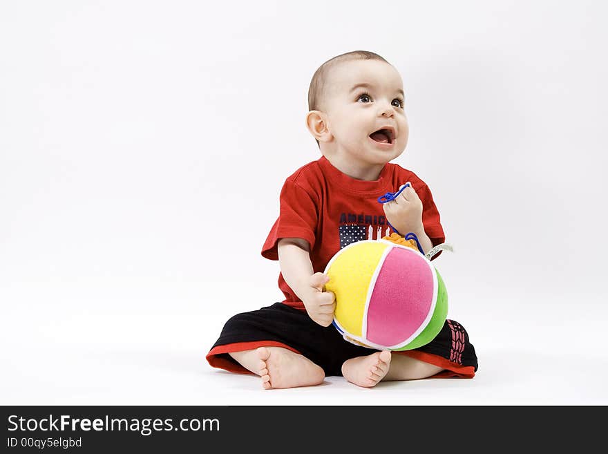 Curious baby in red t shirt. Curious baby in red t shirt