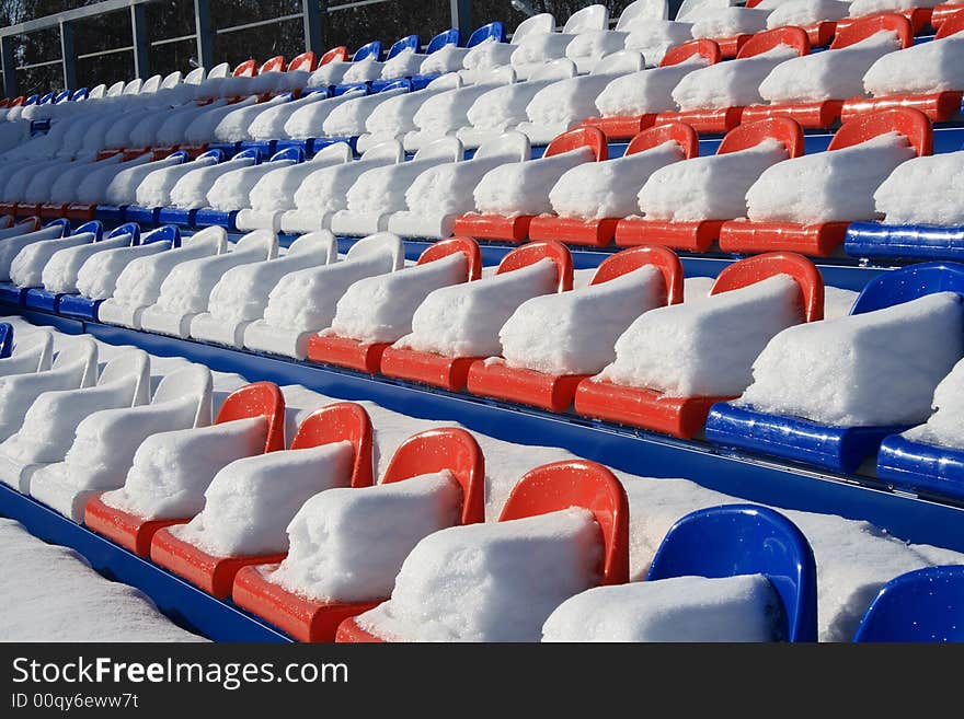 Seats on tribunes of stadium under a snow. Seats on tribunes of stadium under a snow