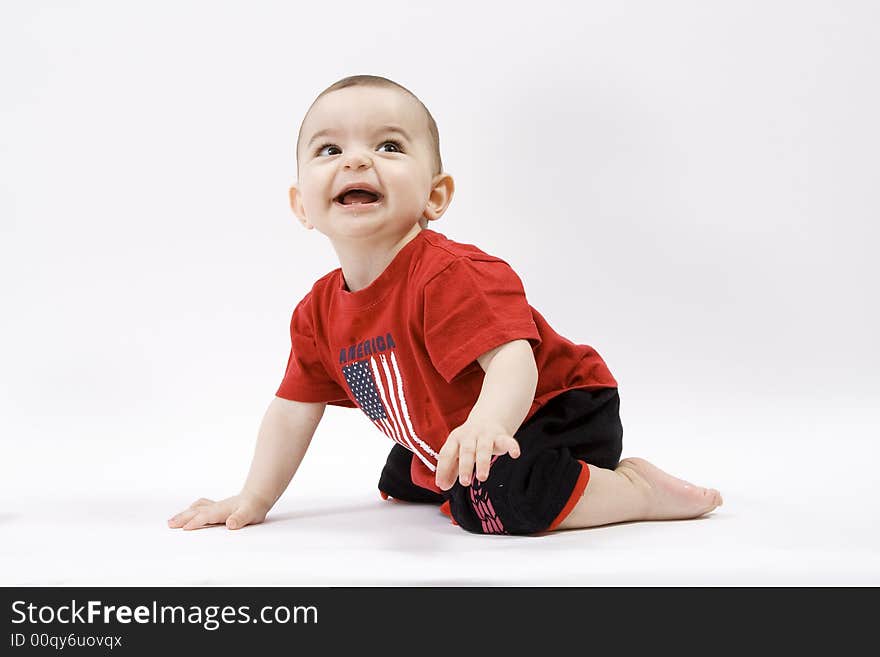 Curious baby in red t shirt. Curious baby in red t shirt