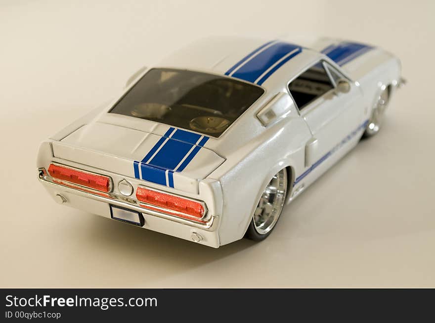 Picture of a toy car. Focus is centered around the tail light area. Picture of a toy car. Focus is centered around the tail light area.