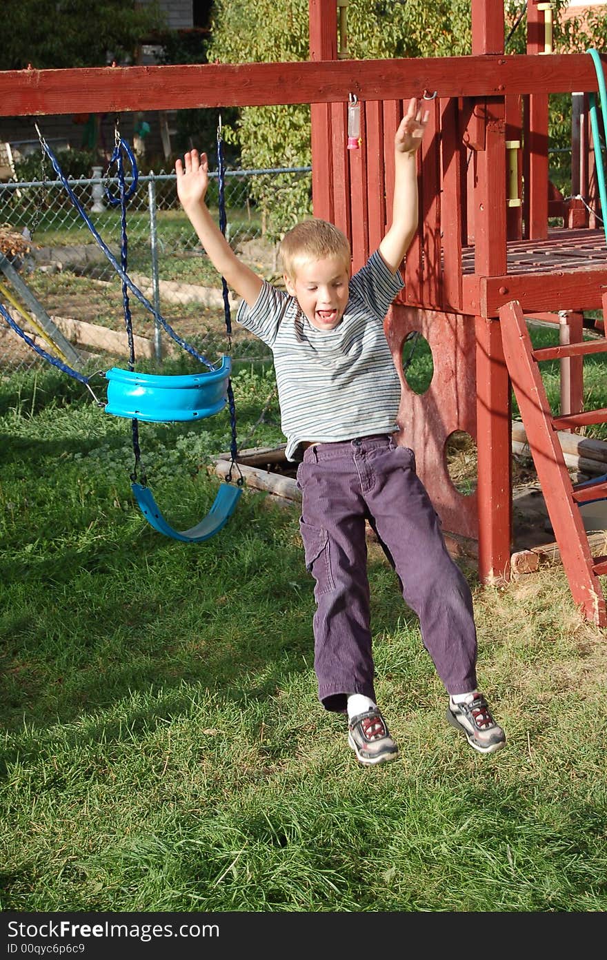 Small Boy wanted Mom to watch him jump out of the swing. He kept doing it until he did the best one. Small Boy wanted Mom to watch him jump out of the swing. He kept doing it until he did the best one.