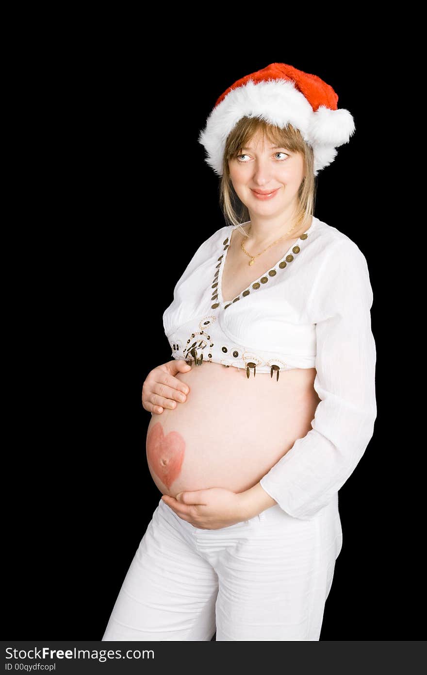 A pregnant lady in a Christmas hat with a black background