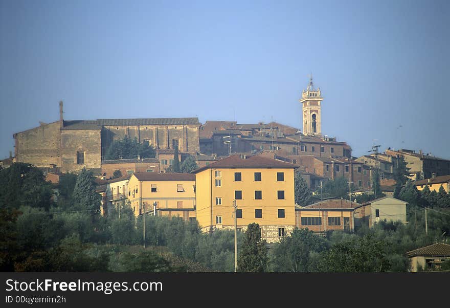 Little italian town at the top of the hill with tower, dawn. Little italian town at the top of the hill with tower, dawn