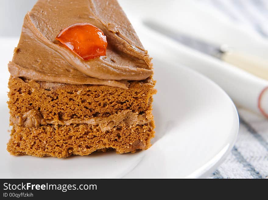 A thick wedge of chocolate cake on a plate