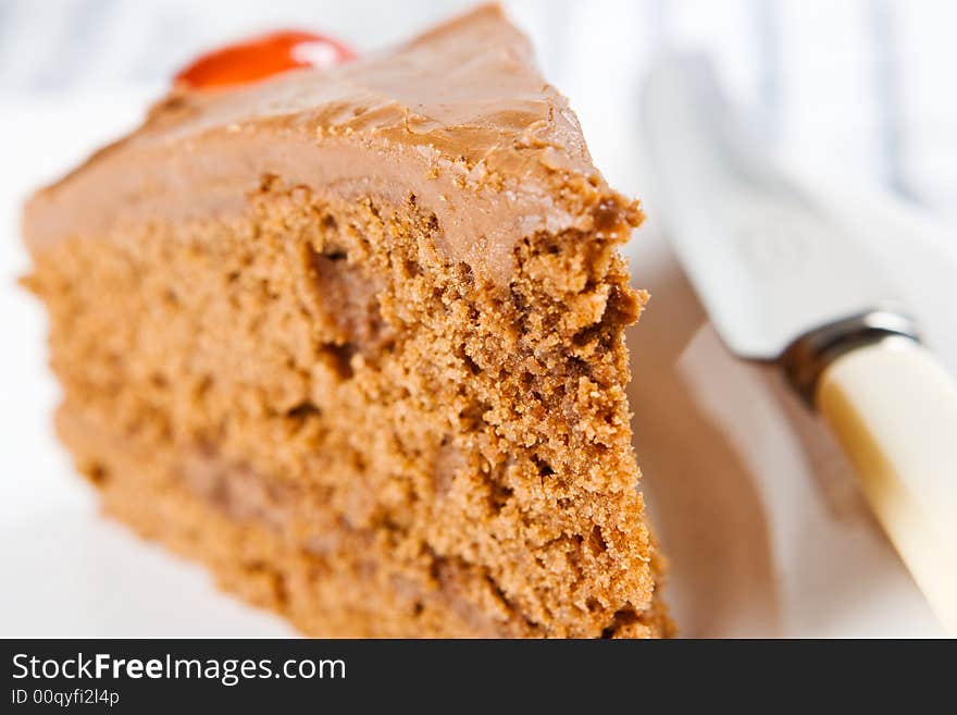 A close up of a thick wedge of tasty chocolate cake. A close up of a thick wedge of tasty chocolate cake