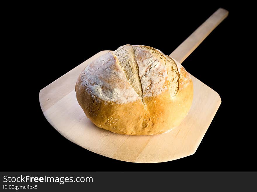 Loaf of crusty Italian bread on peel