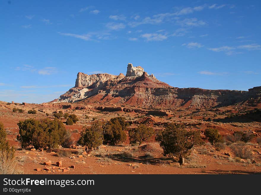 View of the red rock formations in Canyonlands National Park with blue sky�s and clouds. View of the red rock formations in Canyonlands National Park with blue sky�s and clouds