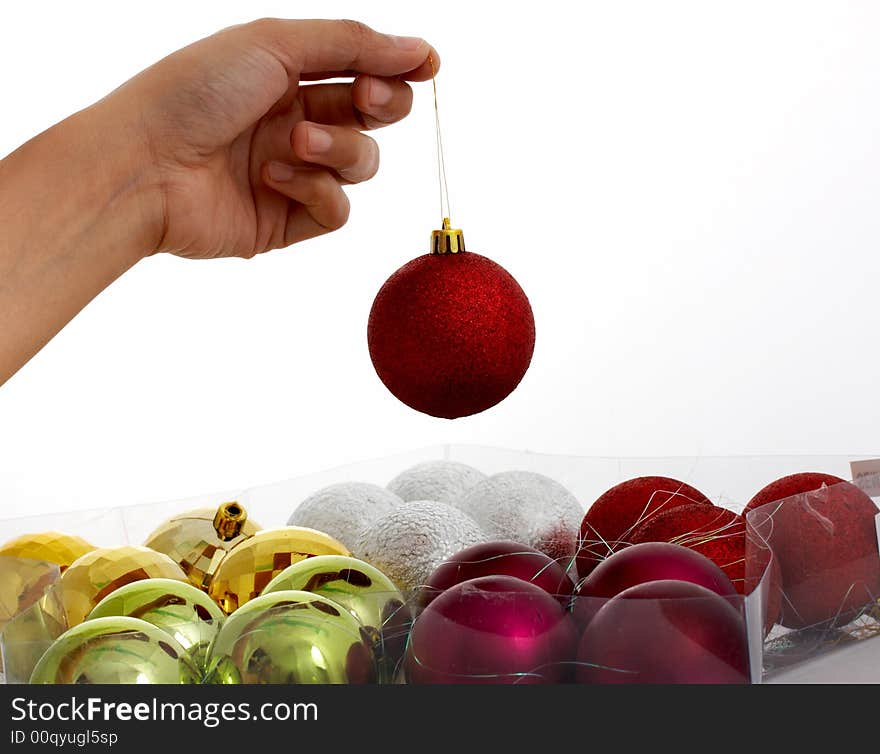 Red christmas decor held by a hand