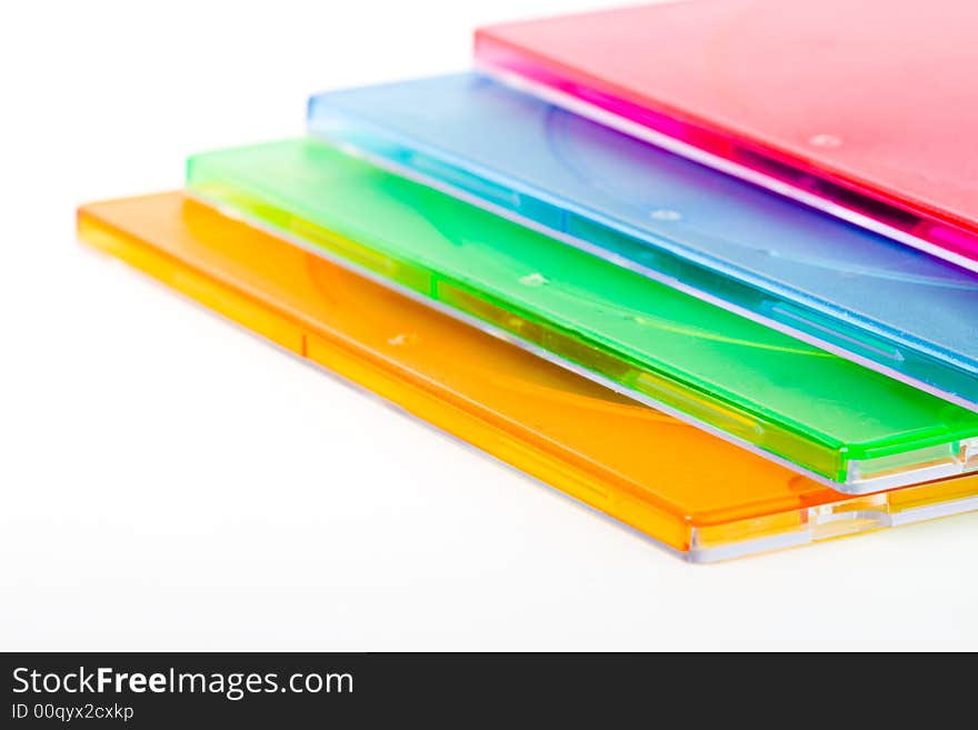 Closeup color stack of disc boxes on white