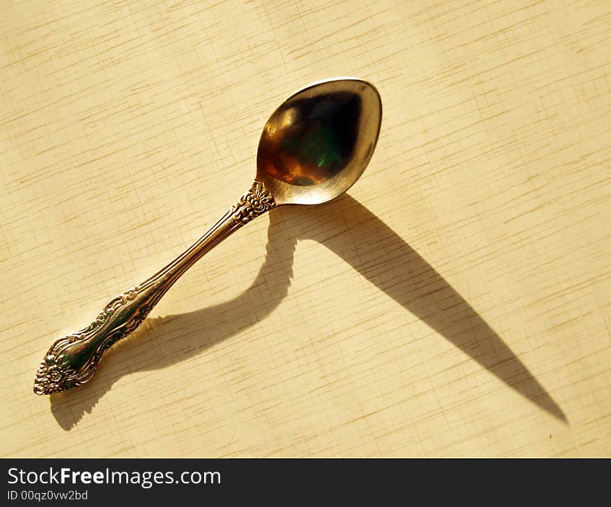 Shadow from the teaspoon is like a question sign. Shadow from the teaspoon is like a question sign