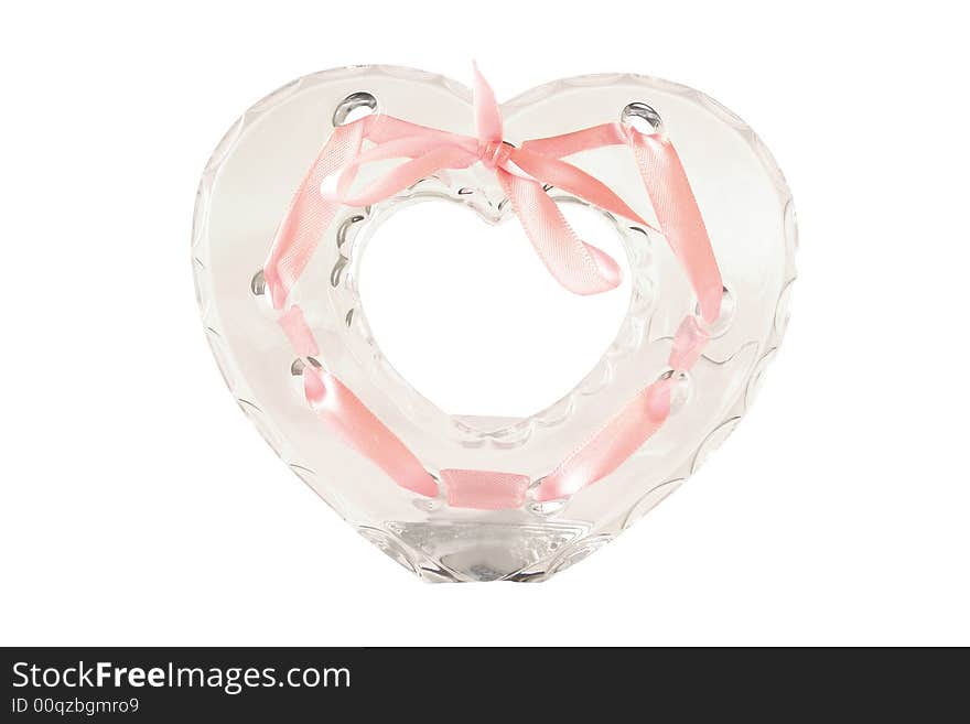 Heart-shaped crystal frame for photo with pink ribbon and bow isolated on white background. Heart-shaped crystal frame for photo with pink ribbon and bow isolated on white background