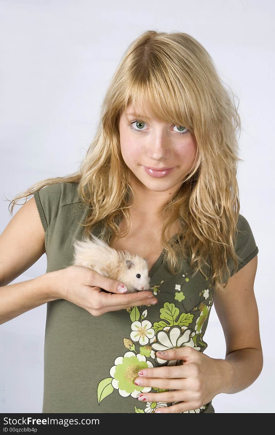 Portrait of young blonde beautiful girl with a mouse. Portrait of young blonde beautiful girl with a mouse