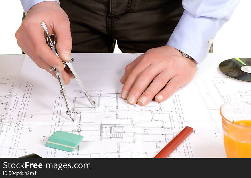 Man work on floor plan. Man work on floor plan