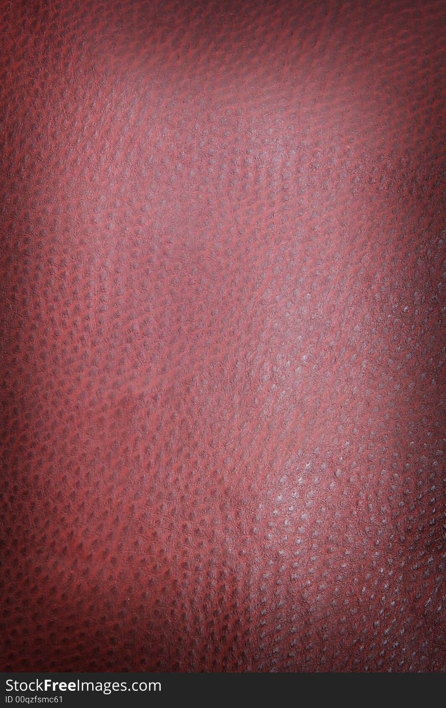 Burgundy spotted leather background shot square on