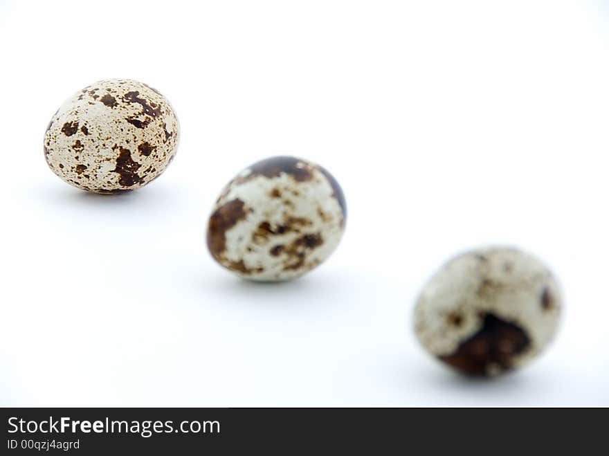 Three quails egg on white background. Three quails egg on white background