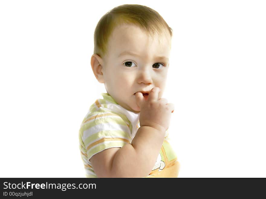 Baby boy with finger in his mouth over white