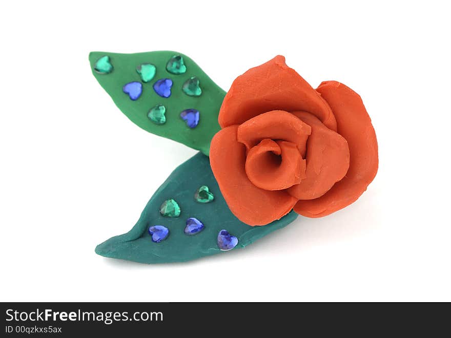 Red rose with leaves made of plasticine